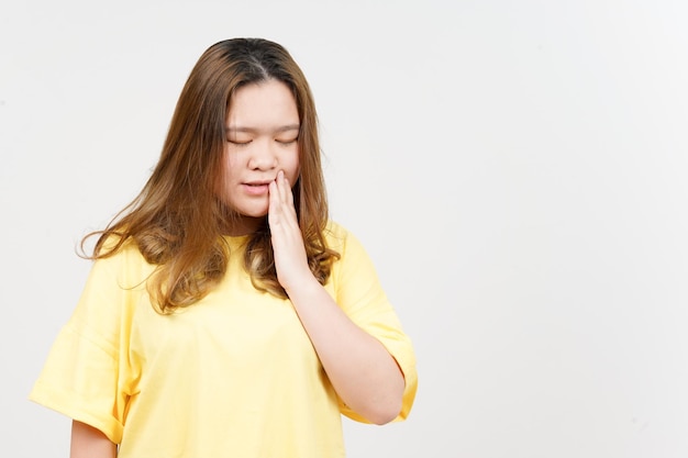 Suffering Toothache of Beautiful Asian Woman wearing yellow TShirt Isolated On White Background