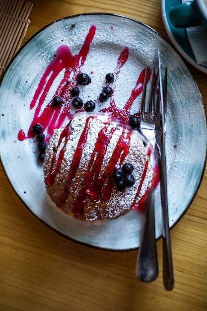 Sugar dessert pan cakes with berries and jam Breakfast concept