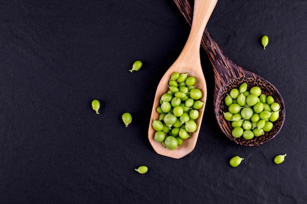 Sugar snap peas with mint on a rustic wood background