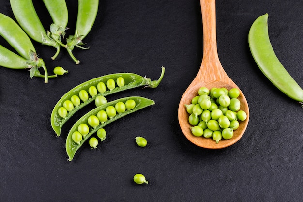 Sugar snap peas with mint on rustic wood 