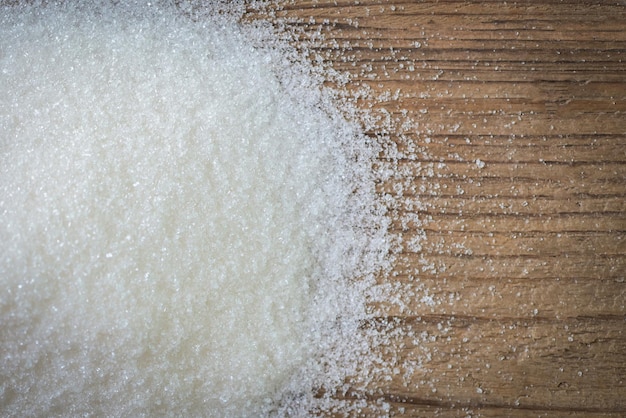 Sugar on wooden background white sugar for food and sweets dessert candy heap of sweet sugar crystalline granulated