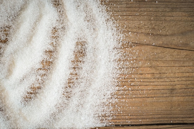 Sugar on wooden background white sugar for food and sweets dessert candy heap of sweet sugar crystalline granulated