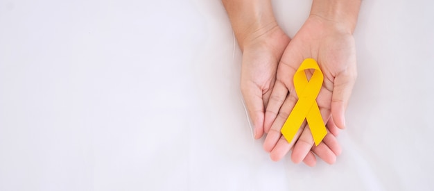 Suicide prevention and Childhood Cancer Awareness, Yellow Ribbon for supporting people living and illness.