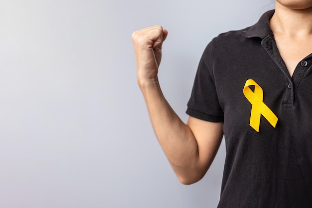 Suicide prevention day Childhood Sarcoma bone and bladder cancer Awareness month Yellow Ribbon for supporting people life and illness children Healthcare and World cancer day concept