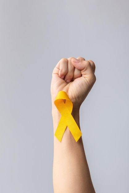 Suicide prevention day Childhood Sarcoma bone and bladder cancer Awareness month Yellow Ribbon for supporting people life and illness children Healthcare and World cancer day concept