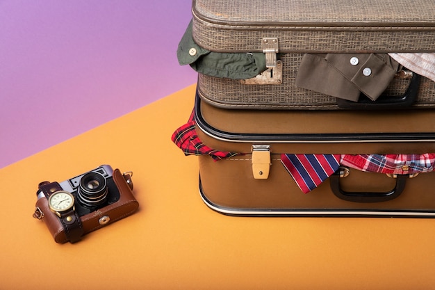 Suitcases for travel filled with clothes and camera