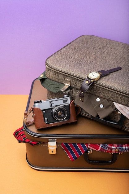 Suitcases for travel filled with clothes and camera