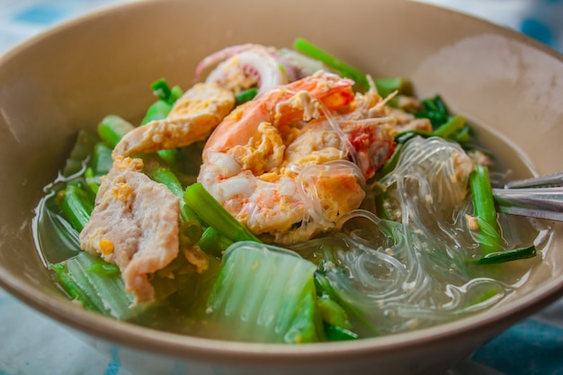 Suki in broth Mixed seafood with vermicelli and vegetables.