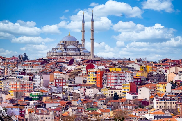 Suleymaniye mosque with colorful residential house area in Istanbul with blue sky background Turkey Istanbul Mosque Suleymaniye minaret with colorful house Beautiful view Istanbul Turkiye