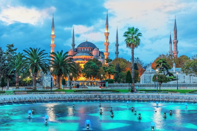 The Sultan Ahmet Mosque and the fountain in the blue shadows of sunrise, Istanbul.