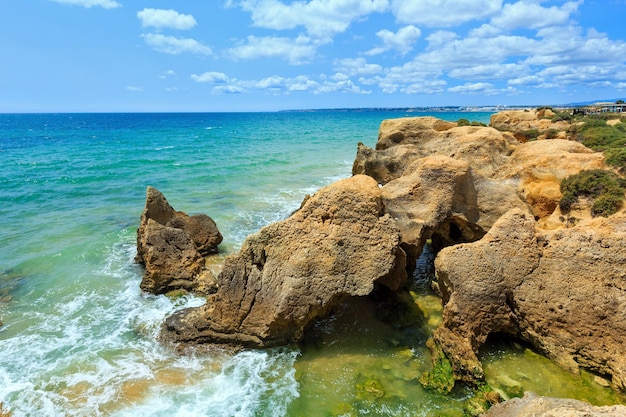 Summer Atlantic rocky coast view Albufeira outskirts Algarve Portugal