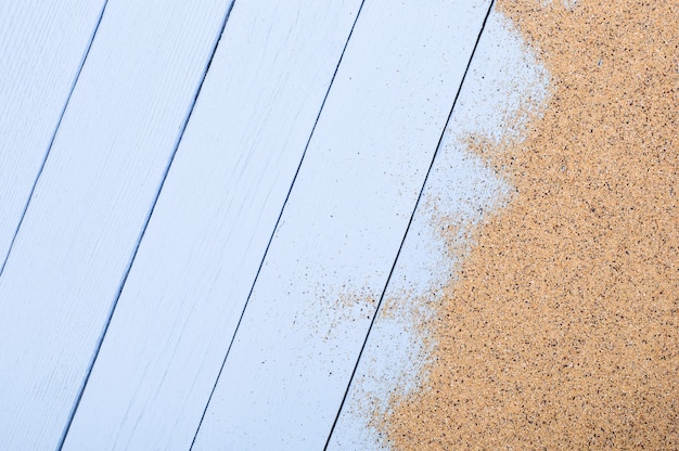 Summer background of blue boards on the sea beach