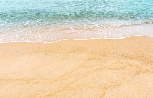 Summer Beach top viewBlue ocean with soft wave form on Sand TextureHorizontal Seaside view of Brown Beach sand dune in Sunny day SpringBackground for TravelVocationSummer Holiday advertisement