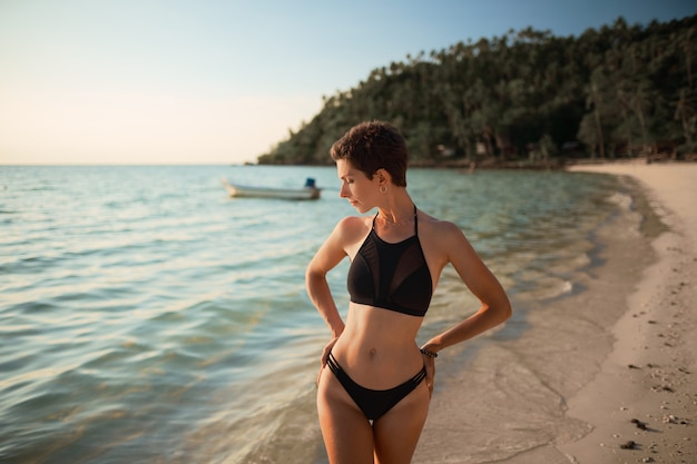 Summer beach vacation concept. happy woman with bikini on the sea