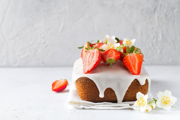 Summer cake with strawberry on white table background