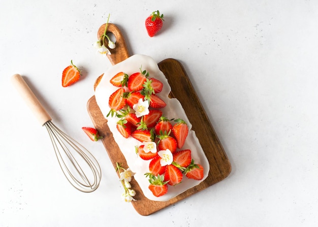 Summer cake with strawberry on white table background