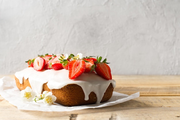 Summer cake with strawberry on white table background