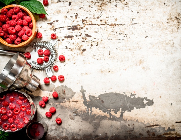 Summer cocktail of wild raspberries.