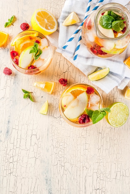 Summer cold cocktail, fruit and berry white sangria 