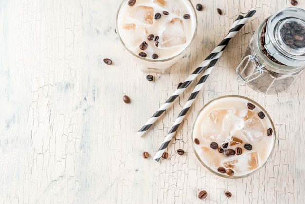 Summer cold Iced coffee frappe with milk and ice cubes