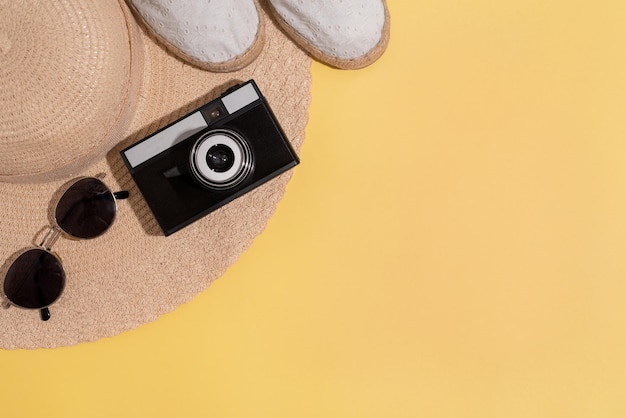 Summer composition on a bright yellow background Copy space flat lay top view