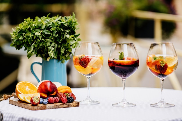 Summer drink from different citrus with fruits