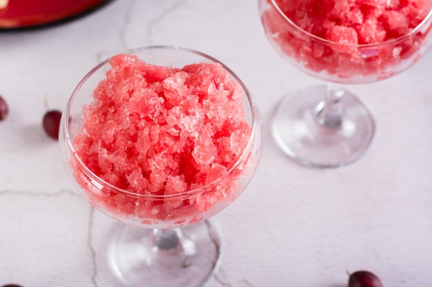 Summer drink frozen wine slushy in glasses on the table Refreshing alcoholic cocktail Closeup