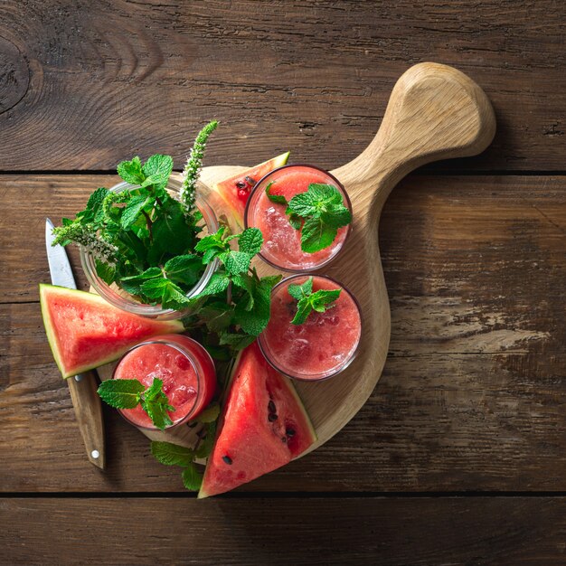 Summer drinks watermelon mojito on wooden background with copy space top view