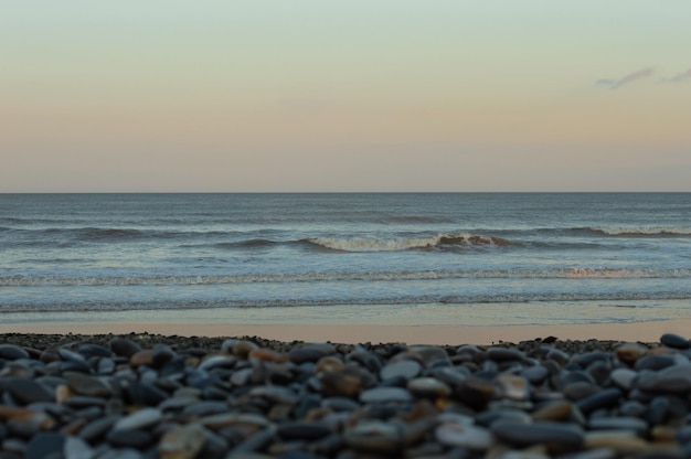 A summer evening the sight of pebbles and the sea