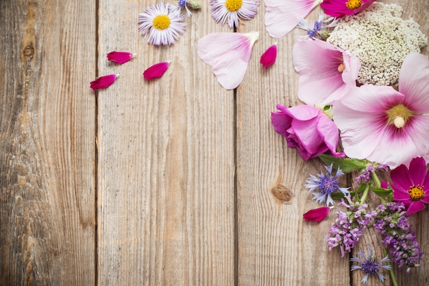 Summer flowers on old wooden