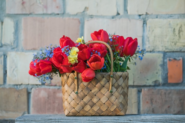 Summer flowers in straw basket