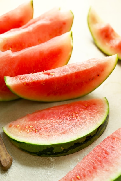 Summer foods background. Ripe watermelon slices in a plate, on warm background