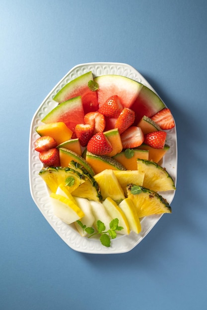 Summer fresh fruits assortment platter antipasti watermelon pineapple melon and strawberries