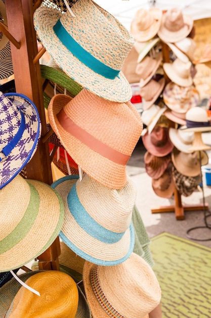 Summer hats for sale at the Farmers Market in early Summer.