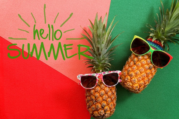 Summer and Holiday concept Pineapple and Fruits on colorful and hello summer word background