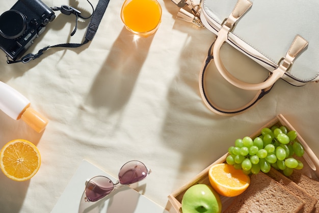 Summer holiday with bag, fruit, sun cream, glasses, accessories on white background