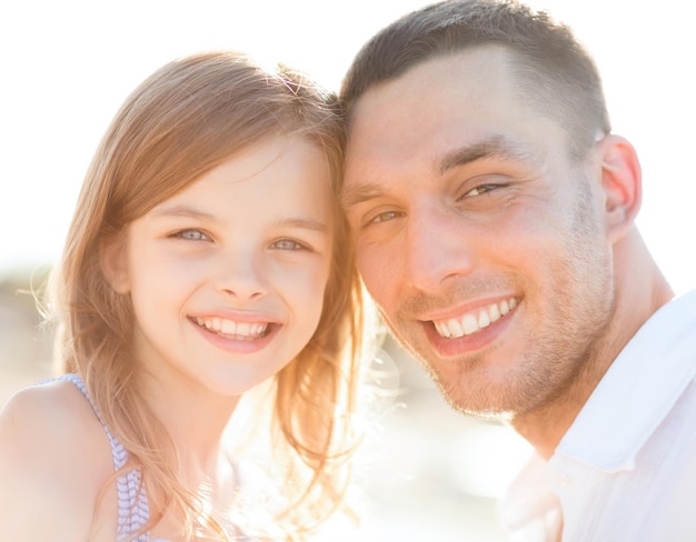 summer holidays, children and people concept - happy father and child girl having fun