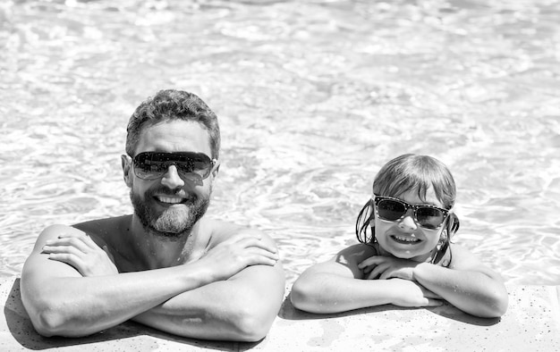 Summer holidays weekend at family day dad and child having fun at pool party