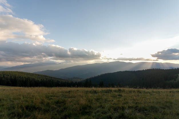 Summer landscape in mountains and the dark blue sky with clouds. Landscape from Bucegi Mountains, part of Southern Carpathians in Romania in a very foggy day