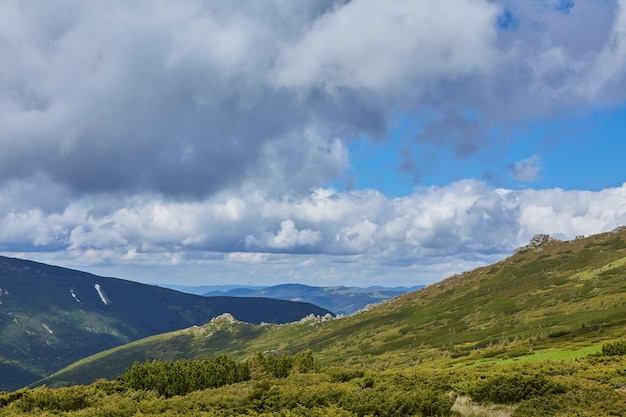 Summer landscape in mountains and the dark blue sky