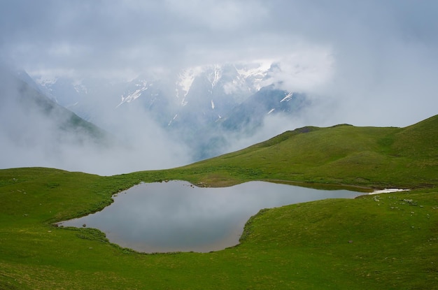 Summer landscape with a mountain lake. Cloudy day. Lake koruldi, Main Caucasian ridge. Zemo Svaneti, Georgia