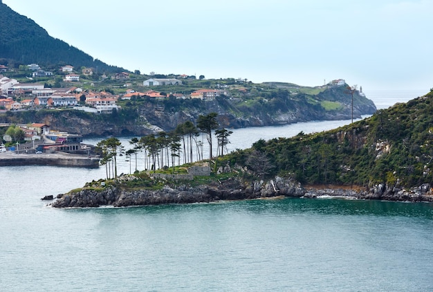 Summer Lekeitio town coasline and San Nicolas island (isla de San Nicolas), Biscay, Spain,  Basque Country.