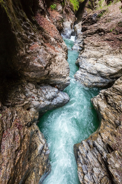 Summer Liechtensteinklamm gorge with stream and waterfalls in Austria.