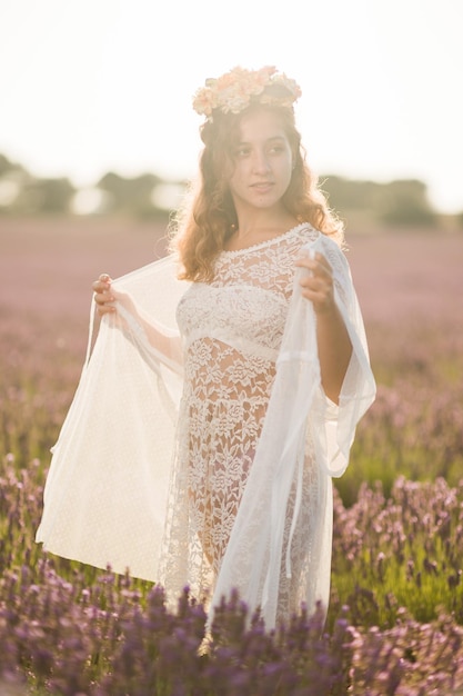 Summer meadow lavender field with young hispanic woman beautiful in nature flower spring