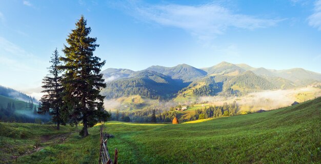 Summer misty mountain village countryside landscape