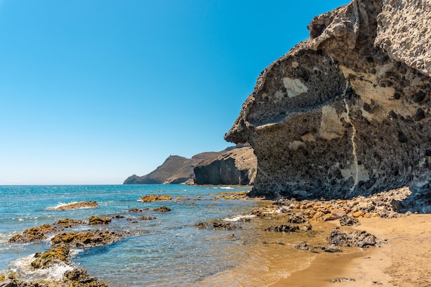 Summer at Monsul Beach in the Cabo de Gata Natural Park, created with eroded lava formations in the municipality of San Jose, Almeria