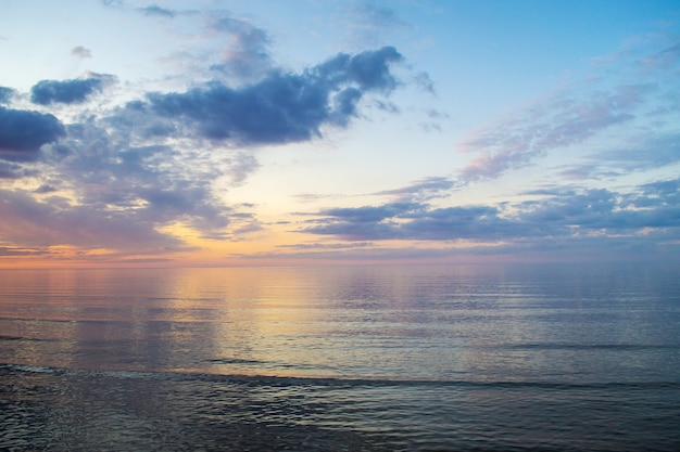 Summer mood warm evening on beach beautiful colorful sunset over baltic sea