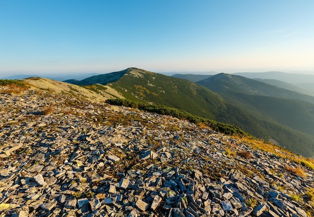 Summer morning Carpathian mountain top view from stony summit of Ihrovets Mount (Gorgany, Ukraine).