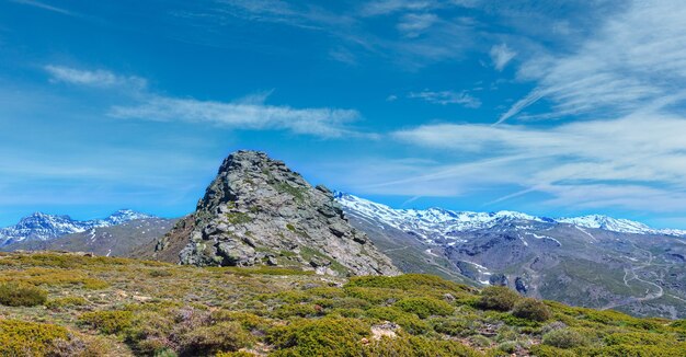 Summer mountain landscape with snow on ridge Sierra Nevada National Park near Granada Spain Multi shots highresolution panorama