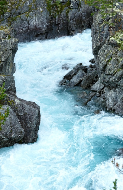 Summer mountain river waterfalls view